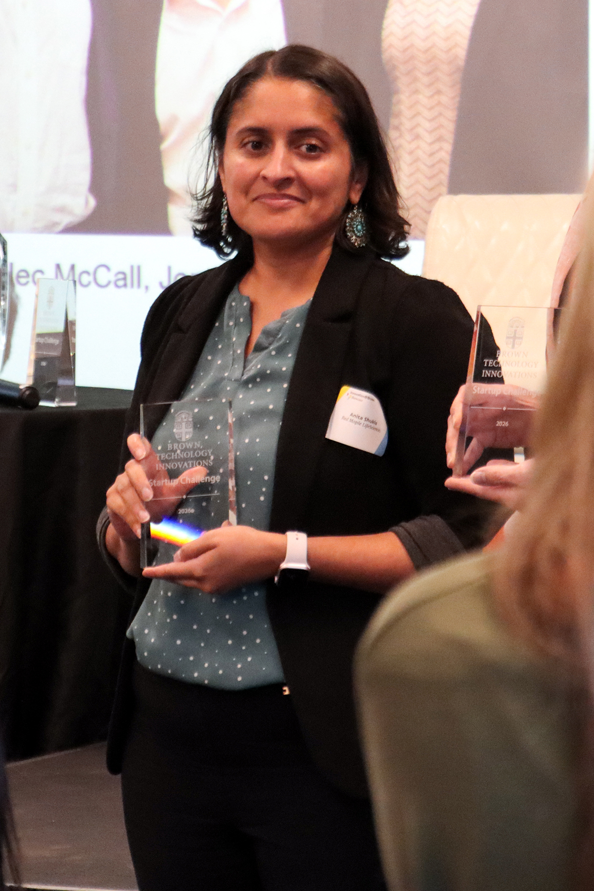 Anita Shukla poses with her award.