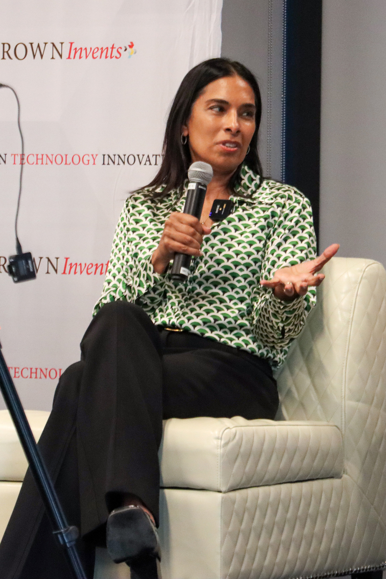 Sangeeta Bhatia speaks on stage.