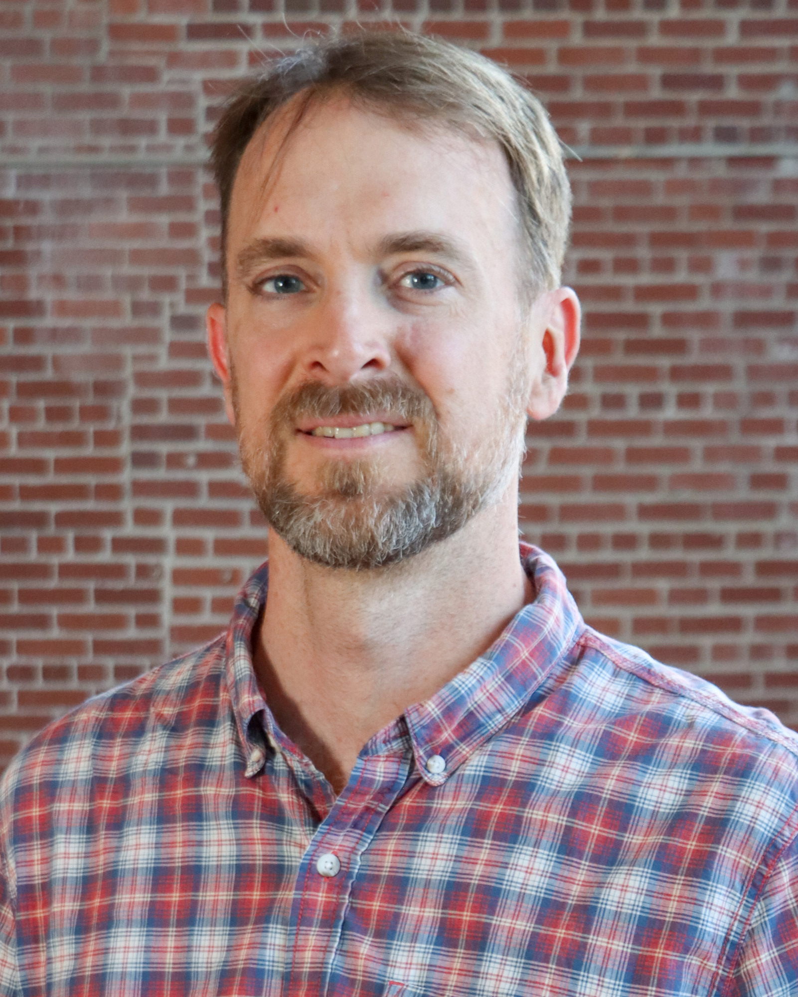A headshot of Stephen Kidd