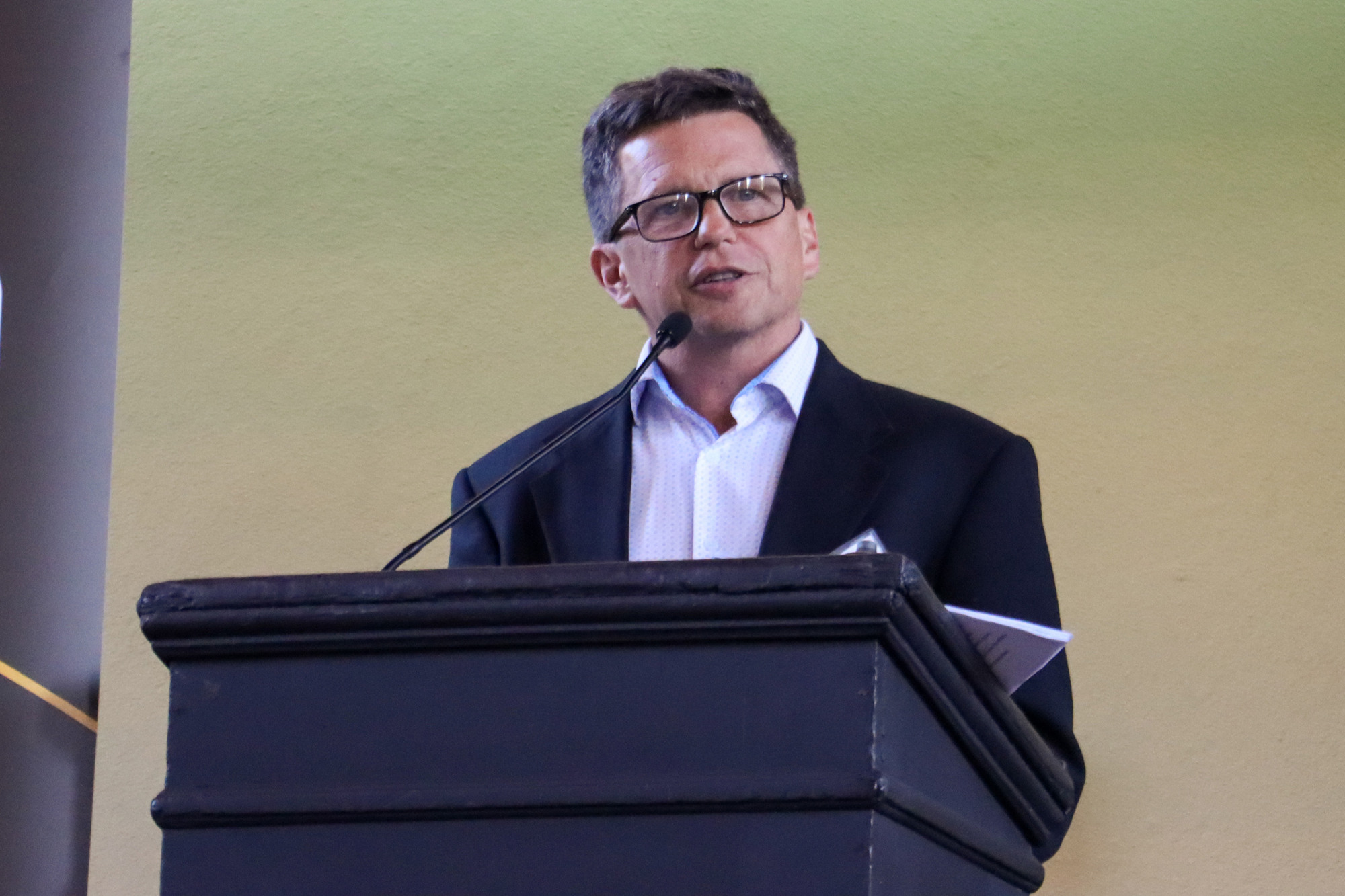 Greg Hirth speaks at a podium at the 2026 Celebration of Research.