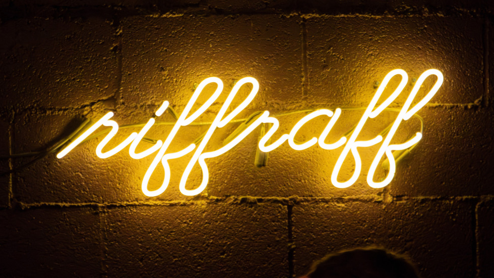 a neow sign reading "riffraff"