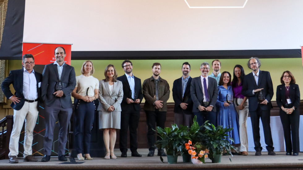 The RAA award winners pose on stage.