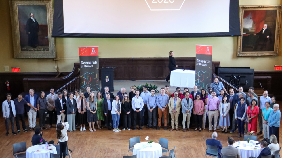 The 2026 Seed awardees pose for a picture in front of the stage.